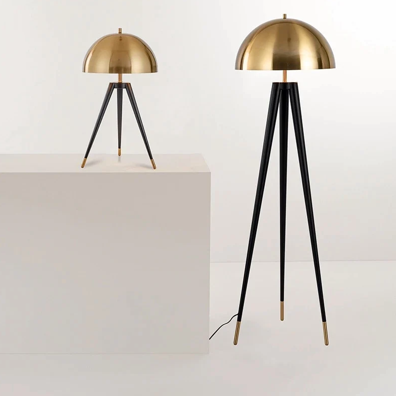 The Velez Lamp is an updated mid-century design featuring lathe turned wood legs.
