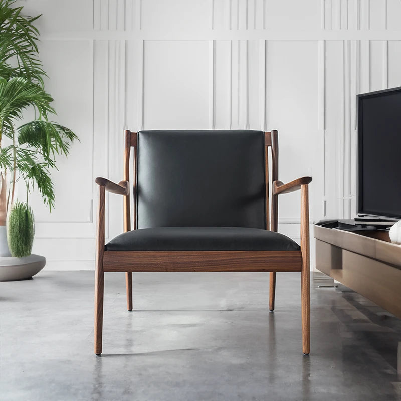 Black accent chair upholstered in microfibre leather: A monochromatic dream