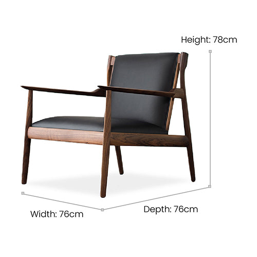 Black accent chair upholstered in microfibre leather: A monochromatic dream